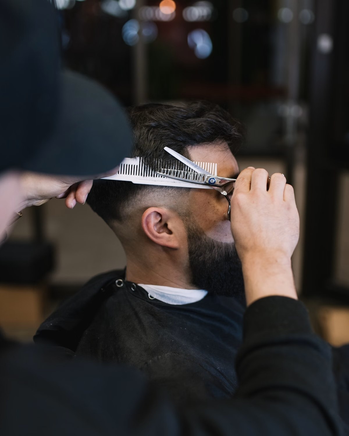 Barber cutting a client’s hair